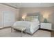 Elegant Primary suite with a large bed and ensuite bathroom at 3491 Byron Ln, Longboat Key, FL 34228