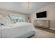 Primary bedroom with large bed and beautiful water views at 3491 Byron Ln, Longboat Key, FL 34228