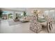 Elegant dining area with glass-top table and patterned chairs, overlooking patio at 3491 Byron Ln, Longboat Key, FL 34228