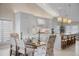 Bright kitchen with white cabinets and a glass dining table at 3491 Byron Ln, Longboat Key, FL 34228