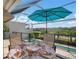 Enjoy outdoor dining with pool and golf course views at 3491 Byron Ln, Longboat Key, FL 34228