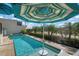 Inviting pool with spa and umbrella, perfect for relaxation at 3491 Byron Ln, Longboat Key, FL 34228