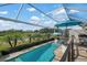 Stunning pool and deck with covered patio and golf course views at 3491 Byron Ln, Longboat Key, FL 34228