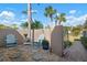 Relaxing side patio with seating area and gate at 3491 Byron Ln, Longboat Key, FL 34228