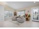 Spacious sitting area with two armchairs and bay window at 3491 Byron Ln, Longboat Key, FL 34228