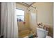 Updated bathroom with a shower/tub combo and a window at 3503 18Th W Ave, Bradenton, FL 34205