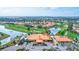 Aerial view of community clubhouse, pool, and golf course at 4202 Caddie E Dr # 202, Bradenton, FL 34203