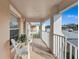 Bright balcony with white chairs and potted plant at 4202 Caddie E Dr # 202, Bradenton, FL 34203