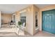 Condo entryway with teal door and small balcony at 4202 Caddie E Dr # 202, Bradenton, FL 34203