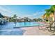 Inviting pool area with lounge chairs and umbrellas at 4202 Caddie E Dr # 202, Bradenton, FL 34203