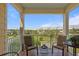 Balcony with seating and a view of the community and manicured green spaces at 423 Bahia Beach Blvd, Ruskin, FL 33570