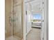 Bathroom showing a glass enclosed shower and views to the bedroom at 423 Bahia Beach Blvd, Ruskin, FL 33570