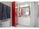 Modern bathroom with red cabinet and granite vanity at 423 Bahia Beach Blvd, Ruskin, FL 33570