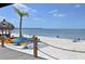 Picturesque beach scene with kayaks, palm trees, and beachgoers enjoying the sun at 423 Bahia Beach Blvd, Ruskin, FL 33570