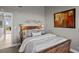 Cozy bedroom with wicker bed frame and access to balcony at 423 Bahia Beach Blvd, Ruskin, FL 33570