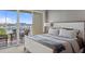 Bedroom with king bed, water views, and private balcony access at 423 Bahia Beach Blvd, Ruskin, FL 33570