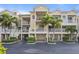 Condo building with private parking and lush landscaping at 423 Bahia Beach Blvd, Ruskin, FL 33570