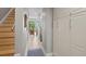 Bright hallway with wood stairs and built-in storage at 423 Bahia Beach Blvd, Ruskin, FL 33570