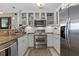 Updated kitchen featuring stainless steel appliances and white cabinets at 423 Bahia Beach Blvd, Ruskin, FL 33570