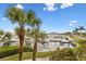 Beautiful view of a marina with lush landscaping and boats at 423 Bahia Beach Blvd, Ruskin, FL 33570