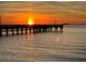 Scenic view of a pier at sunset with a cruise ship in the distance at 423 Bahia Beach Blvd, Ruskin, FL 33570