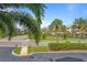 Exterior view of a community with palm trees and buildings at 423 Bahia Beach Blvd, Ruskin, FL 33570