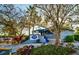 Exterior shot of the restaurant surrounded by lush landscaping and native trees at 423 Bahia Beach Blvd, Ruskin, FL 33570