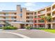 Tan three-story building with balconies and lush landscaping at 4440 Fairways Blvd # 206, Bradenton, FL 34209