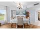 Bright dining room with hardwood floors and chandelier at 4440 Fairways Blvd # 206, Bradenton, FL 34209