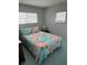 Bedroom with double bed and floral bedding at 4509 10Th Street E Ct, Ellenton, FL 34222