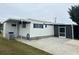 Mobile home with carport and screened enclosure in a residential neighborhood at 4509 10Th Street E Ct, Ellenton, FL 34222