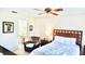 Spacious bedroom with ceiling fan and en-suite bathroom access at 4629 Kingsmere # 20, Sarasota, FL 34235