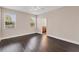 Spacious bedroom with dark wood floors and an ensuite bathroom at 4711 Garden Arbor Way, Bradenton, FL 34203