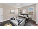 Bedroom with dark floors, featuring a sitting area at 4711 Garden Arbor Way, Bradenton, FL 34203