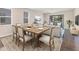 Bright dining room with a wood table and seating for six at 4711 Garden Arbor Way, Bradenton, FL 34203