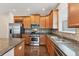 Kitchen with stainless steel appliances and granite counters at 4711 Garden Arbor Way, Bradenton, FL 34203