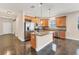 Kitchen features stainless steel appliances and island at 4711 Garden Arbor Way, Bradenton, FL 34203