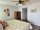 Comfortable bedroom featuring wood-look floors and a ceiling fan at 4900 38Th S Way # 201, St Petersburg, FL 33711