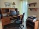 Cozy office space featuring a wooden desk, comfortable chair, and ample storage at 4900 38Th S Way # 201, St Petersburg, FL 33711