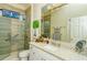 Elegant bathroom with a walk-in shower, granite countertop, and modern fixtures at 5118 Chateau Ct, Sarasota, FL 34238