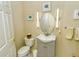 Small bathroom with gray vanity, oval mirror, and updated lighting at 5118 Chateau Ct, Sarasota, FL 34238