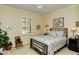 Guest bedroom with a queen-size bed and plantation shutters at 5118 Chateau Ct, Sarasota, FL 34238