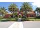 Mediterranean-style community building with palm trees at 5118 Chateau Ct, Sarasota, FL 34238