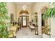 Bright and spacious entryway with tiled floors and decorative furniture at 5118 Chateau Ct, Sarasota, FL 34238