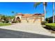 Two-story house with tile roof, three-car garage, and landscaped yard at 5118 Chateau Ct, Sarasota, FL 34238