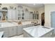 Gourmet kitchen with custom cabinetry, expansive countertops and breakfast bar at 5118 Chateau Ct, Sarasota, FL 34238