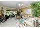 Living room with large windows, neutral colors, and comfortable seating at 5118 Chateau Ct, Sarasota, FL 34238