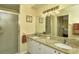 Double vanity bathroom with granite countertop at 5250 Hyland Hills Ave # 1525, Sarasota, FL 34241