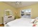 Spacious bedroom with water views and a ceiling fan at 5250 Hyland Hills Ave # 1525, Sarasota, FL 34241