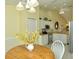 Cozy breakfast nook features a round table and yellow flowers at 5250 Hyland Hills Ave # 1525, Sarasota, FL 34241